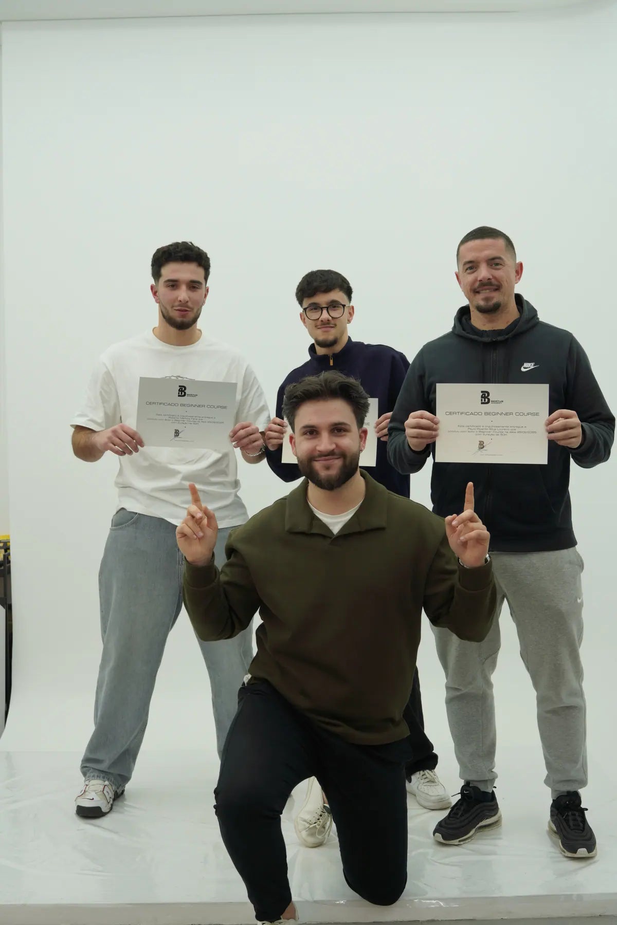 Bertus Academy students holding certificates